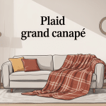 grand canapé recouvert d’un plaid dans salon élégant